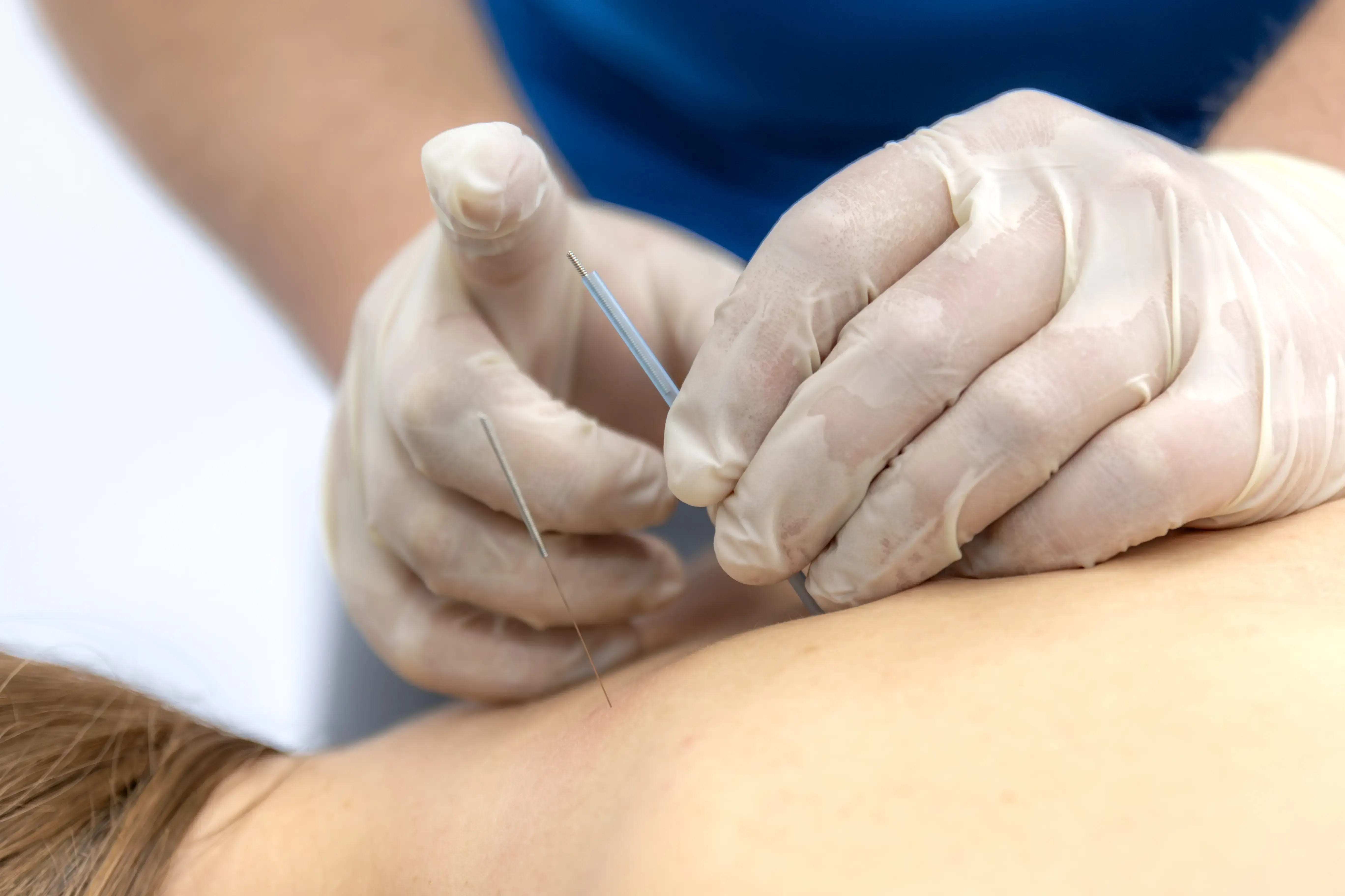 Patient consulting with Dr. Reznikov about trigger point injection benefits at PTCOFMD