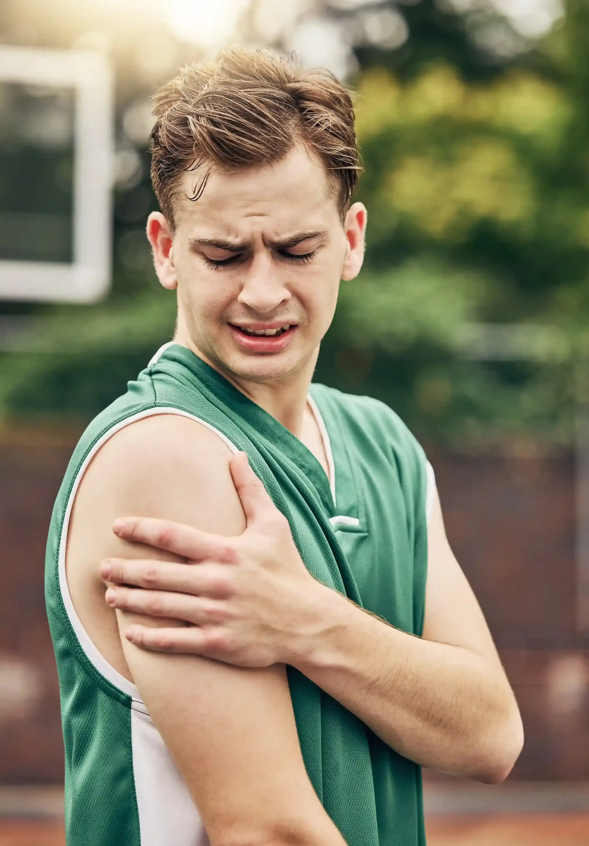 Close-up of patient experiencing shoulder discomfort at Pain Treatment Center of Maryland